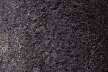 Closeup of gray brown textured stone.