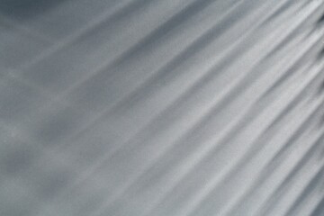 Obraz premium Light and shadows falling on grey background