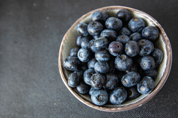 blueberry ripe juicy berries vitamins natural product snack fresh tasty food dish gourmet food background on the table rustic food top view copy space keto and paleo diet Vegetarian and vegan food