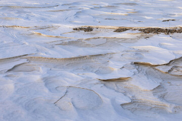 Obraz premium Patterns and rocks on snow in Alaska