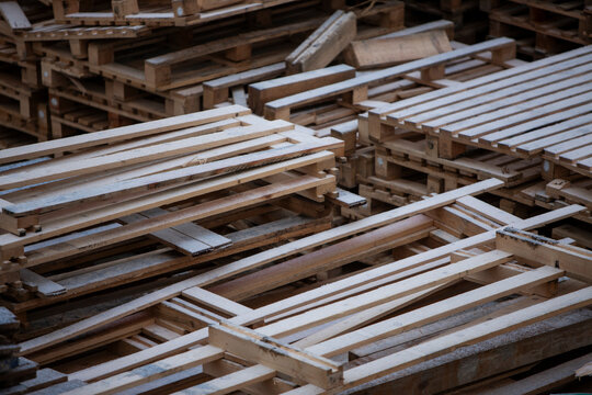 Pile of wooden pallets at a construction site
