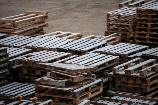 Pile of wooden pallets at a construction site
