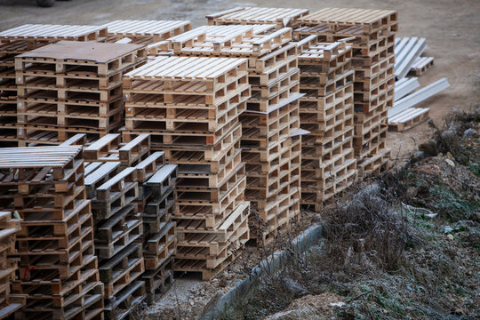 Pile of wooden pallets at a construction site