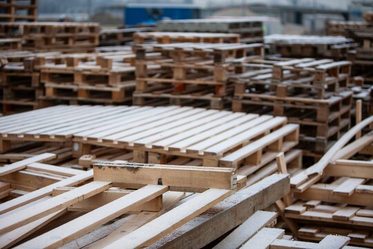 Pile of wooden pallets at a construction site