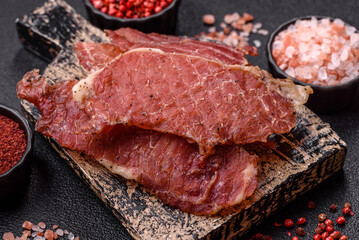 Jerky, dried pork meat slices with salt and spices