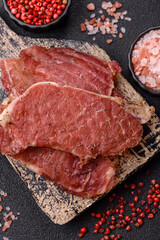 Jerky, dried pork meat slices with salt and spices