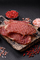Jerky, dried pork meat slices with salt and spices