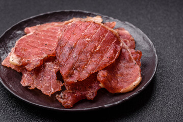Jerky, dried pork meat slices with salt and spices