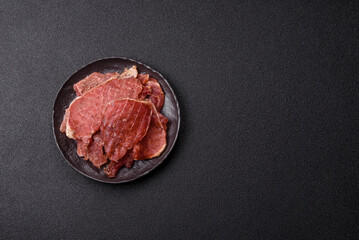 Jerky, dried pork meat slices with salt and spices