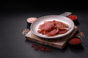 Jerky, dried pork meat slices with salt and spices