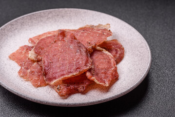 Jerky, dried pork meat slices with salt and spices