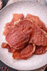 Jerky, dried pork meat slices with salt and spices