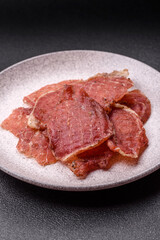 Jerky, dried pork meat slices with salt and spices