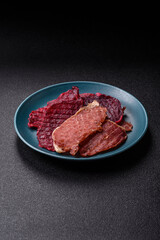 Jerky, dried pork meat slices with salt and spices