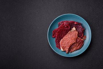 Jerky, dried pork meat slices with salt and spices