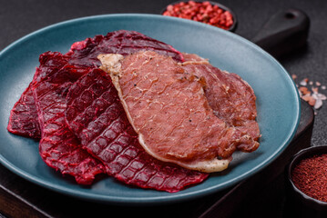 Jerky, dried pork meat slices with salt and spices