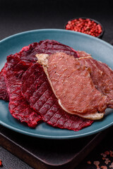 Jerky, dried pork meat slices with salt and spices