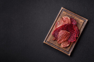 Jerky, dried pork meat slices with salt and spices