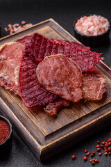 Jerky, dried pork meat slices with salt and spices