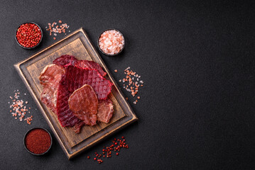 Jerky, dried pork meat slices with salt and spices