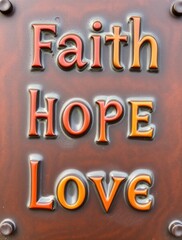 Naklejka premium Words embodying faith, hope, and love shine brightly as symbols of inspiration and spirituality, resonating deeply during significant religious celebrations