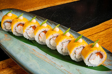 Delightful Sushi Rolls Beautifully Arranged on a Vibrant Green Plate in a Cozy Restaurant Setting, Highlighting Fresh Ingredients and Culinary Artistry at Lunchtime.