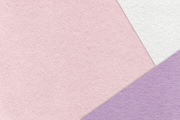 Texture of craft light pink color paper background with white and lilac border. Vintage abstract...