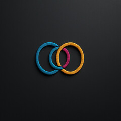 Bunte Ringe in harmonischer Anordnung auf schwarzem Hintergrund


