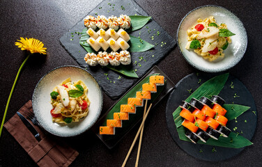 Gourmet Sushi and Colorful Appetizers Beautifully Arranged on Elegant Plates at a Vibrant Dining Establishment Showcasing Culinary Artistry.