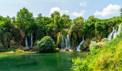 Bosnia and Herzegovina, Kravica Waterfall - 20 August 2024 - The Kravica waterfalls with the lush...