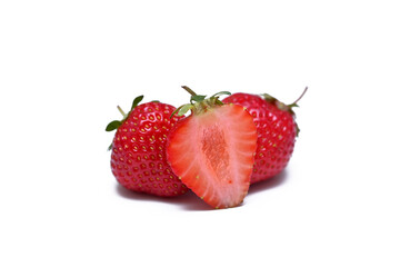 whole strawberry and cut berry isolated on a white background close up