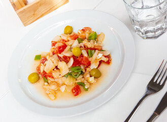 Delicious seafood salad from slices of cod and vegetables