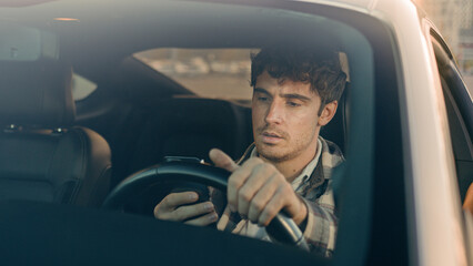 Disappointed stressed sad man Caucasian auto driver businessman inside automobile car waiting in...