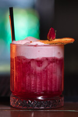 A beautiful bright cocktail. Restaurant, a glass with a drink is on the table