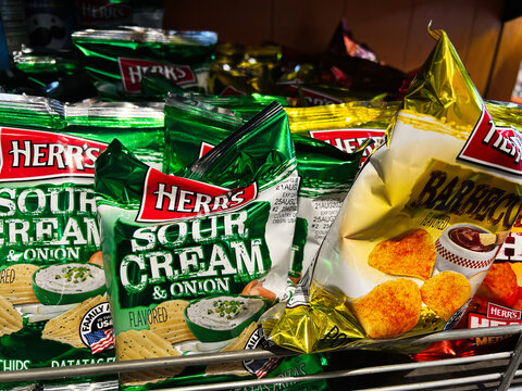 Kyiv, Ukraine - February 11, 2025: Close-up of  Herr's snack display featuring assorted flavored potato chips in packaging