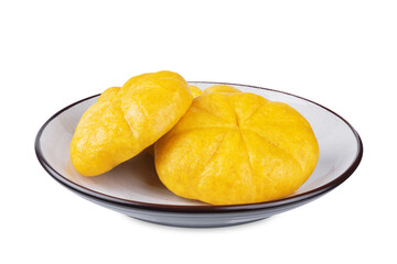 Pumpkin steamed buns with red bean paste filling in a plate on a white isolated background