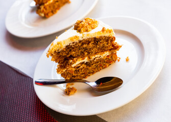 Slice of delicious carrot cake closeup. High quality photo
