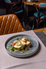 Salmon Benedict served on a plate, top view