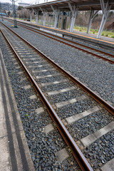 Fototapeta premium Railway Tracks at a Modern Station Setting