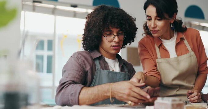 Ceramic teacher, student and lesson with clay for pottery course, instructions or art and crafts at workshop. Female person, instructor or teaching junior artisan with mold for creative DIY creation