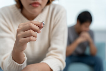 Divorce. Woman remove married ring. Couples desperate and disappointed after marriage. Husband wife...