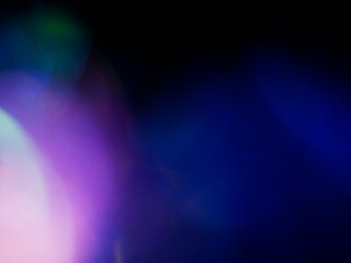 Blue color light leaks on dark background for design and special effects.