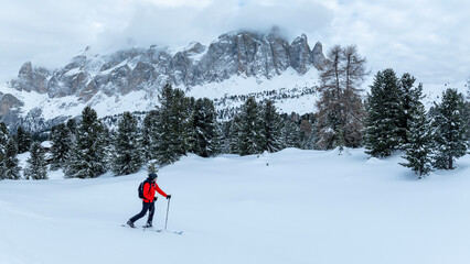 Backcountry Skier Walking in the scenic mountains in Dolomites, Panorama, italy