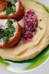 Delicious cutlets with airy mashed potatoes served in the restaurant. The perfect photo for a menu, culinary blog, or an advertisement for catering establishments.