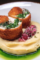 Delicious cutlets with airy mashed potatoes served in the restaurant. The perfect photo for a menu, culinary blog, or an advertisement for catering establishments.