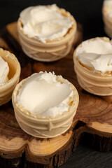 waffle cups with buttercream during dessert cooking