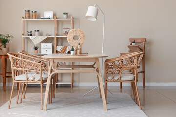 Interior of cozy dining room with wooden table and shelf unit
