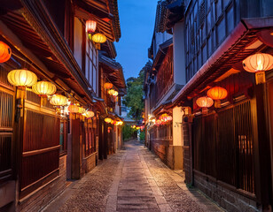 Obraz premium Traditional lanterns illuminating a narrow alley in a historic district at dusk.