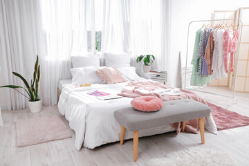 Interior of modern comfortable bedroom with houseplants