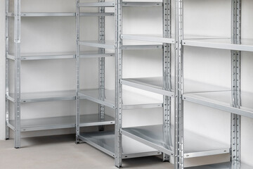 Industrial style metal shelving unit. Modern warehouse space. Empty storage room